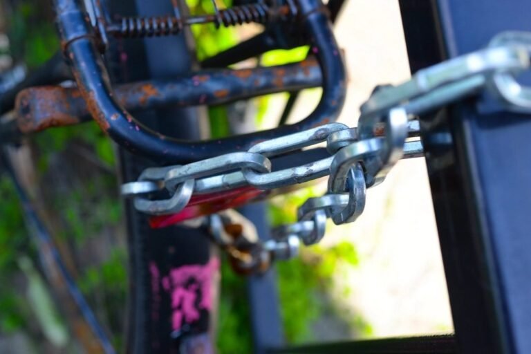 A bicycle frame secured to a stand with a heavy chain lock